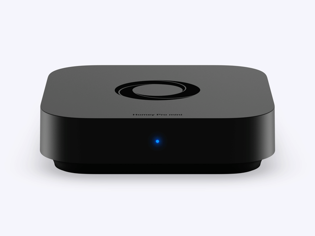 A Homey Pro mini device with a breathing blue LED indicator